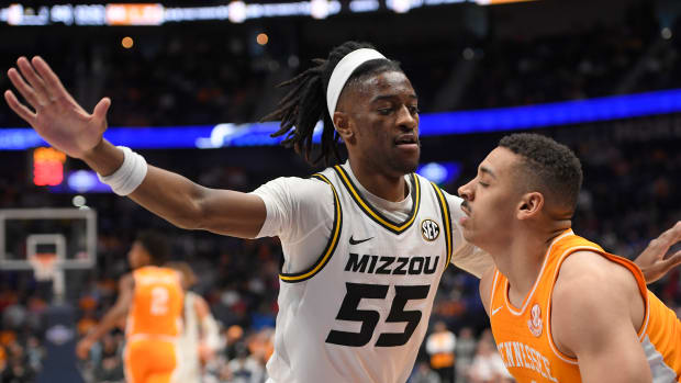 Missouri Tigers guard Sean East II (55) guards Tennessee Volunteers guard Tyreke Key (4) during the second half at Bridgestone Arena in the 2023 SEC Tournament.